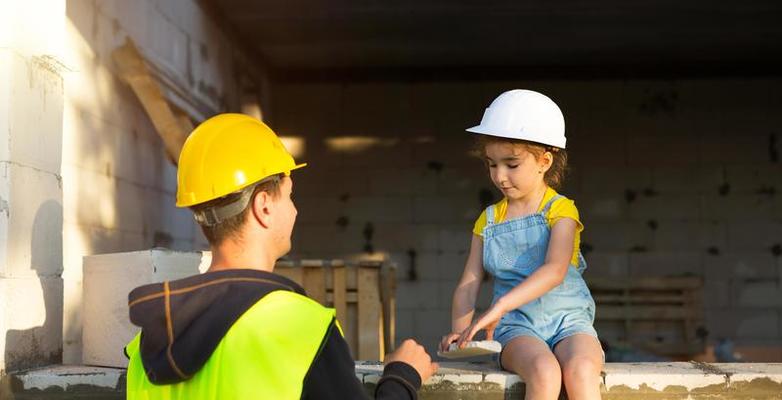 dad and daughter are at construction site of their future home the choice of the future profession of a builder is inherited by child the expectation of moving the dream of a house mortgage loan photo 1